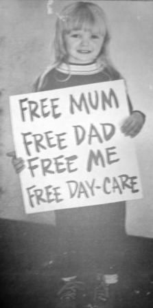 child holding placaard free mum free dad free me free daycare